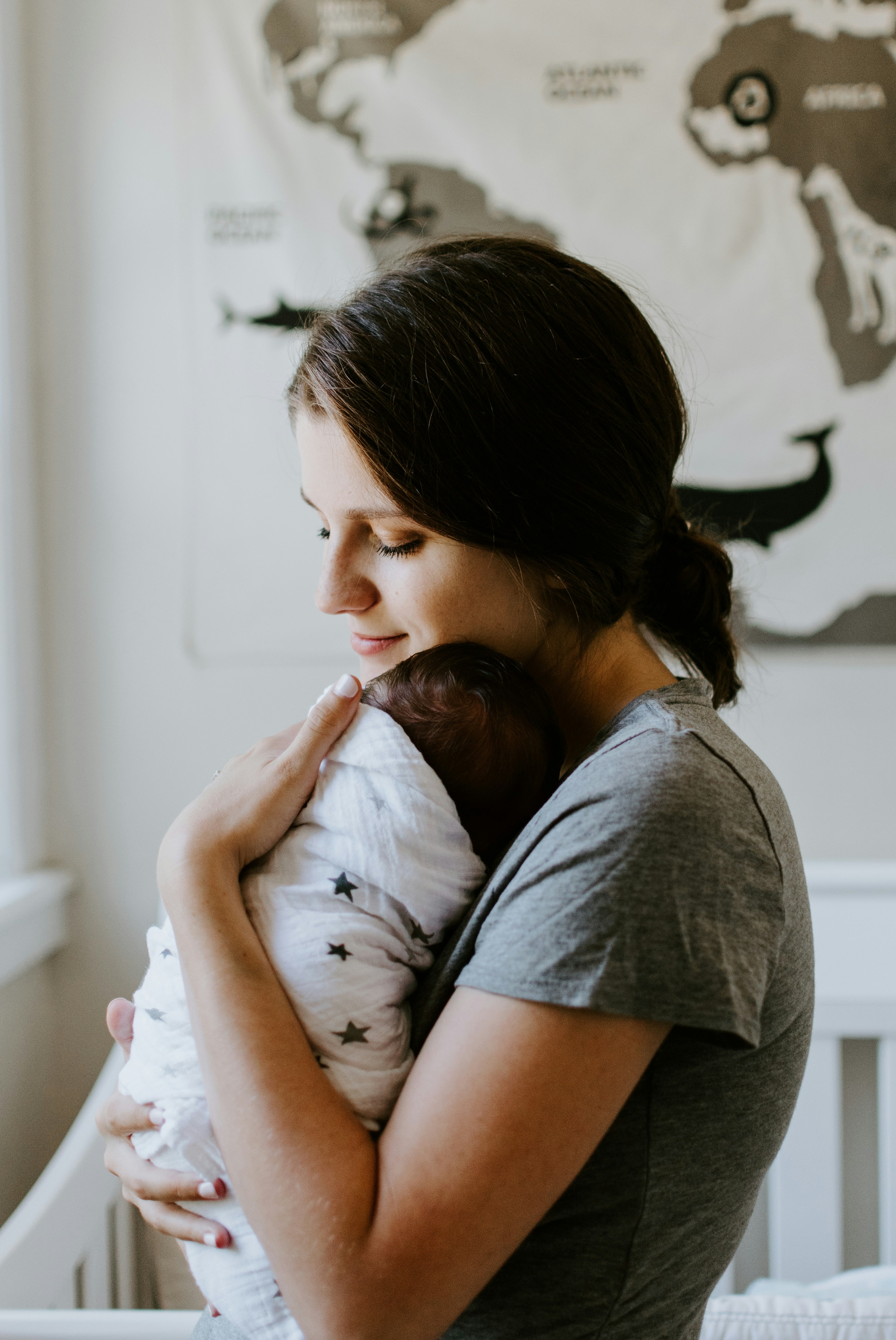 Mother holding newborn after birth